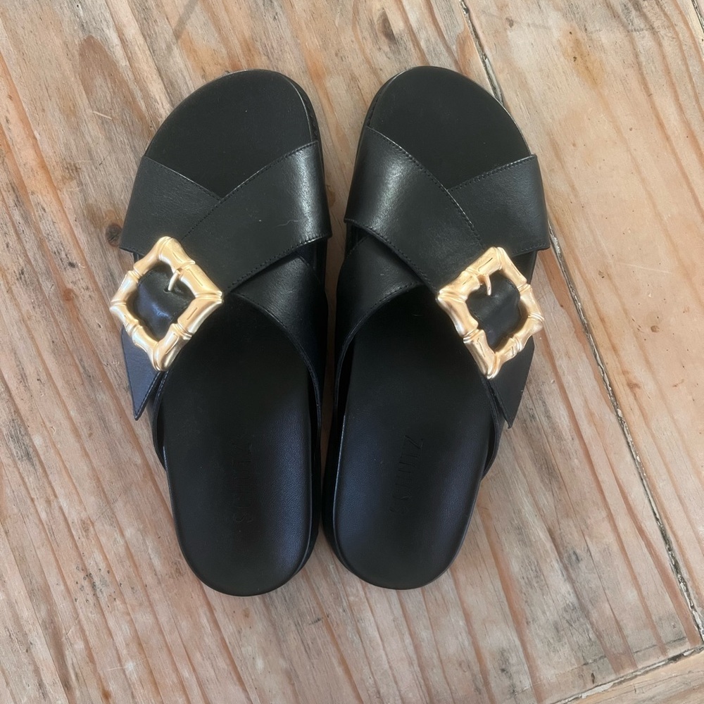 SCHUTZ Black Leather Slide Sandals with Gold Buckle